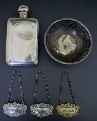 Lot 304 - George V silver hip flask, three Elizabeth II decanter labels, George V shallow bowl