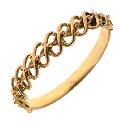 Lot 158 - Late Victorian/Edwardian yellow metal hinged bangle