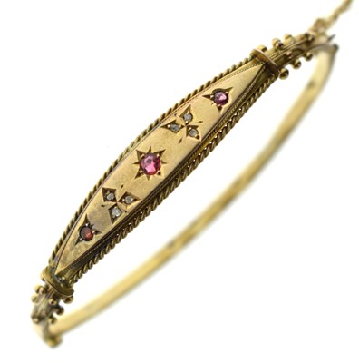 Lot 159 - Late Victorian/Edwardian gem-set yellow metal bangle