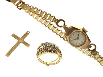 Lot 188 - 9ct gold cased watch, 9ct gold cross pendant, sapphire yellow metal stacking rings (3)