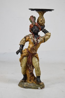 Lot 456 - Painted terracotta figure of a blackamoor