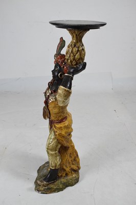 Lot 456 - Painted terracotta figure of a blackamoor