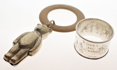 Lot 340 - Early 20th century white-metal napkin ring together with a silver-plated teddy bear teether