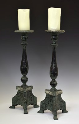 Lot 418 - Pair of Continental altar style candlesticks