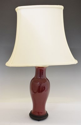 Lot 517 - Sang-de-boeuf glaze porcelain baluster vase, probably Chinese (lamped)