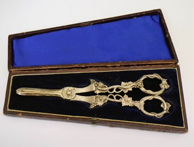 Lot 274 - A pair of cased Victorian grape scissors with typical vine and fruit decoration