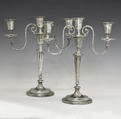 Lot 94 - Pair of George V silver twin branch, three-light candelabra