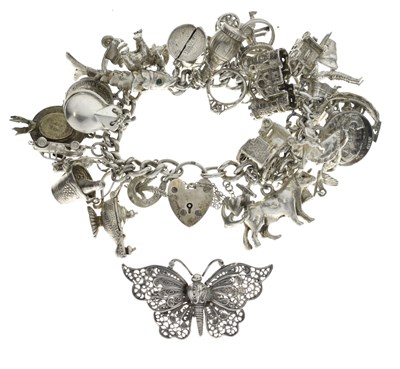 Lot 166 - Silver curb link charm bracelet and white-metal butterfly brooch