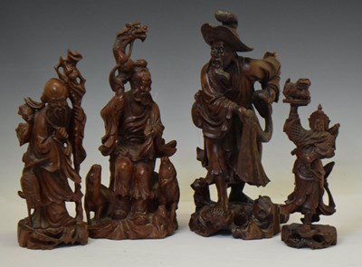 Lot 529 - Four Chinese carved rootwood figures