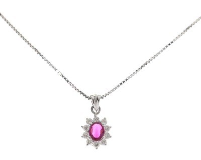 Lot 133 - Ruby and diamond oval cluster white metal pendant