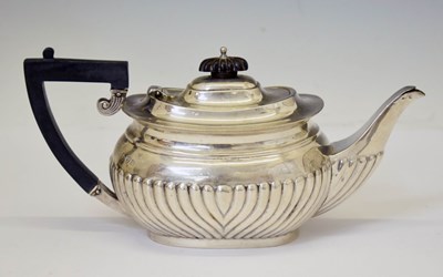 Lot 334 - George V silver teapot with gadroon decoration