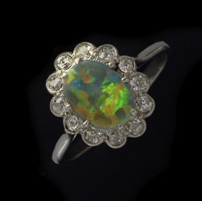 Lot 15 - Black opal and diamond platinum cluster ring