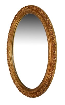 Lot 597 - Oval giltwood mirror with foliate frame