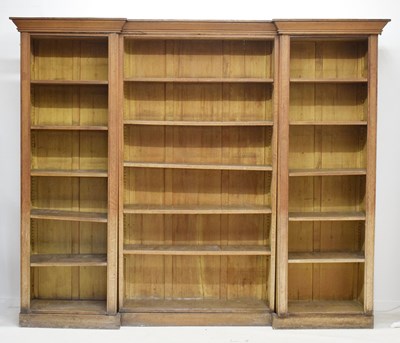 Lot 713 - Edwardian oak inverted breakfront open bookcase