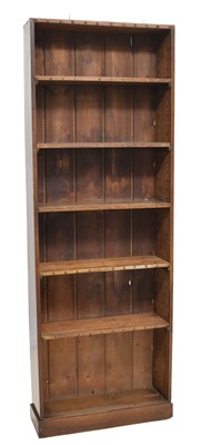 Lot 714 - Late 19th century stained pine narrow open bookcase