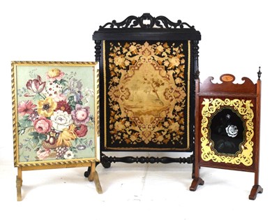 Lot 507 - Victorian ebonised and tapestry firescreen, plus two others