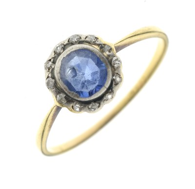 Lot 86 - Sapphire and diamond yellow metal cluster ring