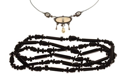 Lot 138 - Chinese mother-of-pearl and simulated pearl pendant necklace together with a jet necklace