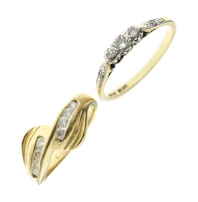 Lot 72 - Diamond three-stone ring, together with a yellow metal dress ring (2)