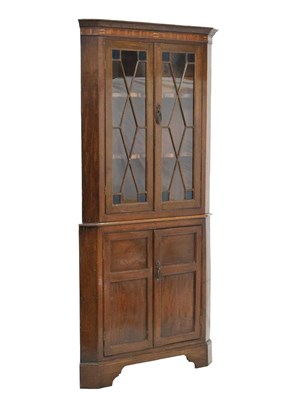 Lot 579 - 19th century inlaid oak floor-standing corner cabinet