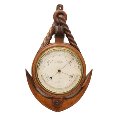 Lot 531 - Early 20th century oak nautical theme barometer with anchor motif