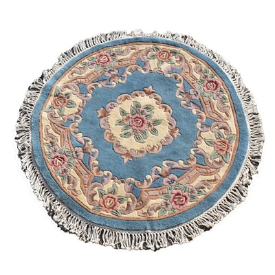 Lot 525 - Chinese circular blue ground wool rug