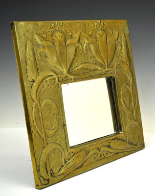 Lot 148 - Arts and Crafts brass framed wall mirror in the manner of Alexander Ritchie of Iona