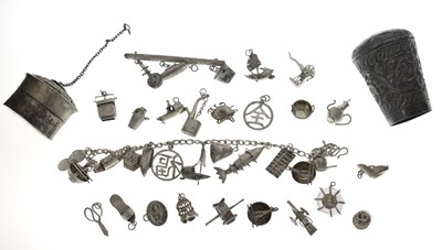 Lot 132 - White metal bracelet with ten attached charms, etc