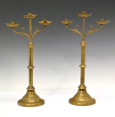 Lot 488 - Pair of Ecclesiastical style brass candelabra