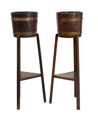 Lot 654 - Pair of oak plant stands