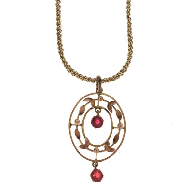 Lot 60 - Edwardian yellow metal pendant with two red stone drops