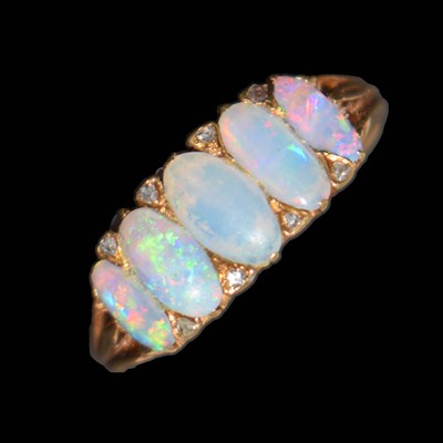 Lot 17 - Opal five stone yellow metal ring