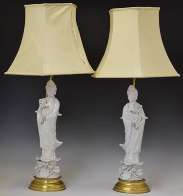 Lot 221 - Mirror pair of Chinese Dehua blanc de chine porcelain figures of Guanyin (now as table lamps)