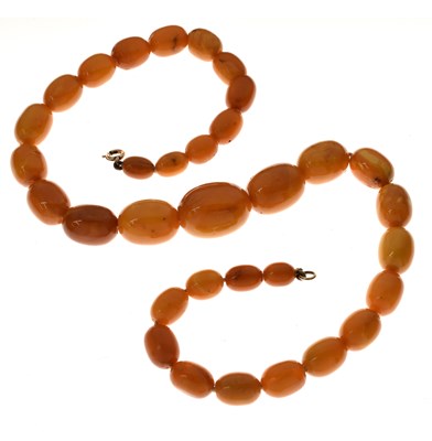 Lot 37 - String of graduated oval butterscotch amber beads