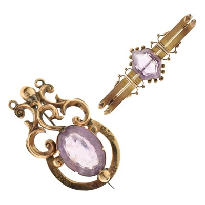 Lot 57 - Two Victorian amethyst yellow metal brooches