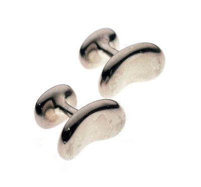 Lot 51 - Elsa Peretti for Tiffany & Co. - Pair of bean design sterling silver cufflinks