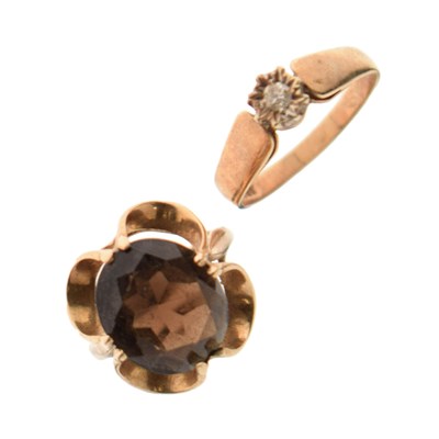 Lot 53 - 9ct gold illusion set solitaire diamond ring and a 9ct gold smoky quartz dress ring