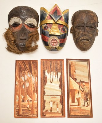Lot 298 - Ethnographica: Three tribal masks and three African marquetry panels