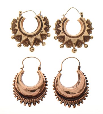 Lot 145 - Two pairs of 9ct gold Eastern style crescent hoop earrings