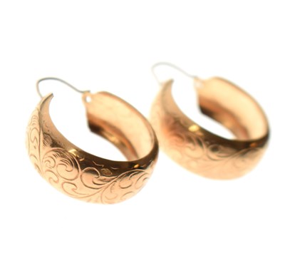 Lot 140 - Large pair of foliate engraved half hoop earrings