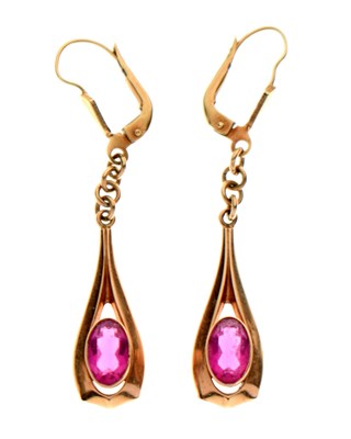 Lot 141 - Pair of pink gem set drop earrings