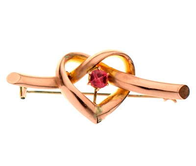 Lot 127 - Heart motif bar brooch set a pink stone