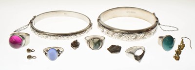 Lot 119 - Small group of silver jewellery including two silver bangles, a moss agate cabochon silver ring, etc