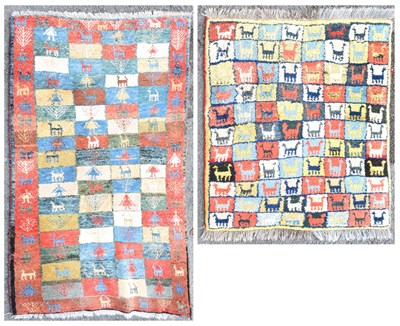 Lot 515 - Two Middle Eastern wool rugs decorated with animals