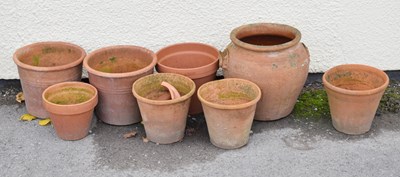Lot 571 - Victorian terracotta crock pot together with seven terracotta garden planters