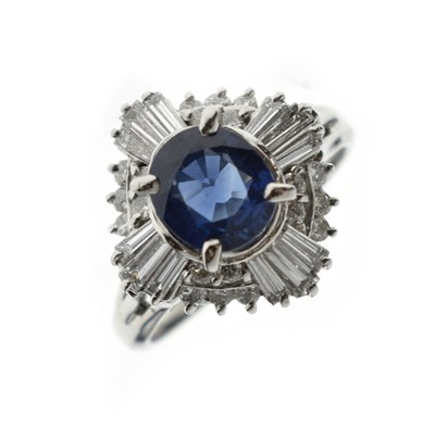 Lot 11 - Sapphire and diamond platinum cluster ring