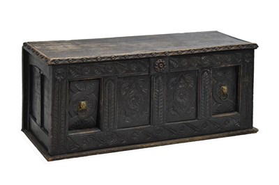 Lot 561 - Oak four-panel coffer with carved decoration