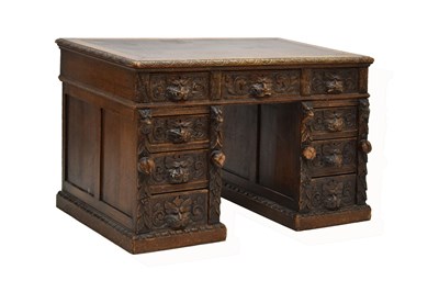 Lot 529 - Victorian carved oak pedestal desk fitted with nine drawers