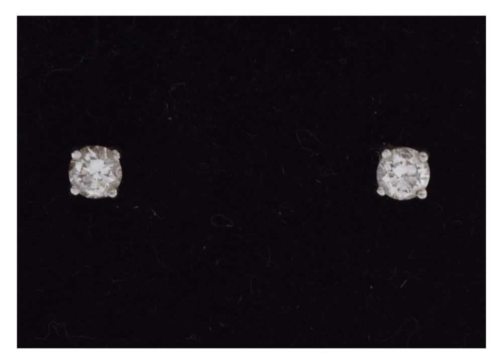 Lot 66 - Platinum diamond single stone stud earrings