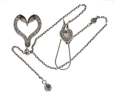 Lot 123 - 'The Grappler' - Late Victorian nickel silver adjustable dress-holder